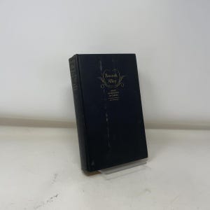 May include: A hardcover book titled "Peacock Alley" by James W. Gerard. The book has a dark cover with gold lettering and a decorative design. The book is standing upright on a clear plastic stand.