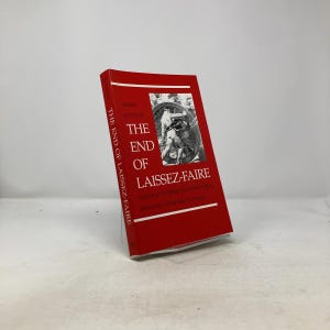 Op de afbeelding: Een rood boek getiteld "The End of Laissez-Faire" van Robert Kuttner. De omslag bevat een zwart-wit illustratie en witte tekst. De rug heeft ook witte tekst. De ondertitel van het boek is "National Purpose and the Global Economy After the Cold War."