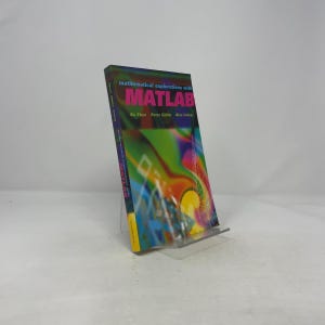 May include: A book titled "mathematical explorations with MATLAB" is displayed on a clear plastic stand. The book cover features a vibrant, abstract design with the word MATLAB in large, pink letters. The authors' names are listed below.