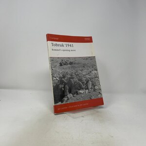 May include: A softcover book titled Tobruk 1941: Rommel's opening move by Jon Latimer and illustrated by Jim Laurier. The cover features a black and white historical photograph of soldiers in a desert trench, with red bands at the top and bottom.
