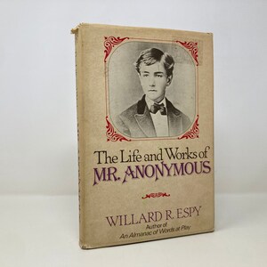 May include: A vintage book cover with a portrait of a young man in a suit and bow tie. The title is "The Life and Works of MR. ANONYMOUS" by Willard R. Espy, author of "An Almanac of Words at Play."