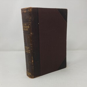 May include: A brown leather-bound book with gold lettering on the spine. The title is "The C.L.S. Reference Library" and the author is "Josephine Daskam Bacon".