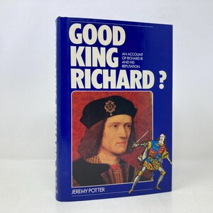 May include: A blue book cover with the title "Good King Richard?" in white text. The book cover features a portrait of King Richard III and a smaller image of a man in armour. The book is about the life and reputation of King Richard III.