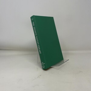 May include: A hardcover book titled "The Chinese Knight-Errant" in a dark green cover. The book is propped up on a clear plastic stand. The text is in white.