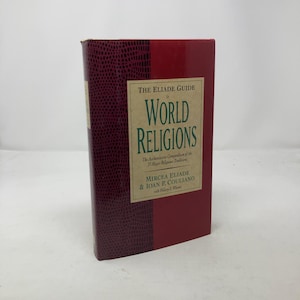 May include: A burgundy hardcover book titled "The Eliade Guide to World Religions: The Authoritative Compendium of the 53 Major Religious Traditions" by Mircea Eliade & Ioan P. Couliano with Hilary S.  Winn.