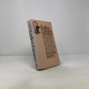 May include: A hardcover book titled "Endless Enemies" by Jonathan Kwitny. The book has a light brown cover with black text and a graphic of an eagle and globe. The spine of the book also displays the title.