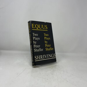 May include: A black hardcover book titled Equus and Shrivings, Two Plays by Peter Shaffer. The front cover features yellow and white text on a black background, with the title Equus in yellow at the top and Shrivings in white at the bottom.