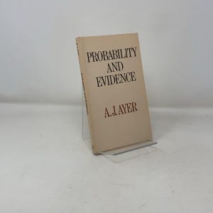 May include: A beige book with the title "Probability and Evidence" by A.J. Ayer.