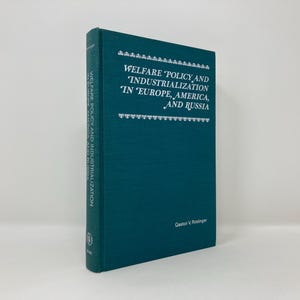 May include: A teal blue hardcover book titled "Welfare Policy and 'Industrialization 'In 'Europe, America, and Russia'" by Geston V. Riminger.