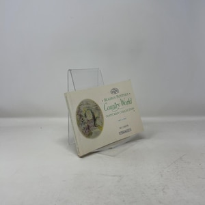 May include: A stack of Beatrix Potter's Country World postcard collection. The cover features an oval illustration of a garden scene with a gate. The text on the cover reads "Country World Postcard Collection" and "30 Cards".