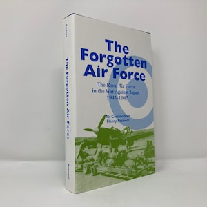 May include: A white book with a blue title "The Forgotten Air Force" and a subtitle "The Royal Air Force in the War Against Japan 1941-1945". The book cover features a photo of an aircraft and soldiers.