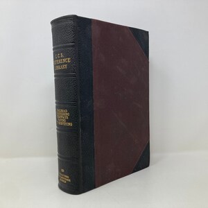 May include: A black leather-bound book with gold lettering on the spine. The title is "L.C.S. Reference Library" and the subtitle is "Railroad Engineering, Highways, Paving & Surfacing".