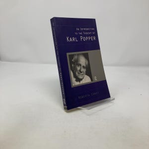 May include: A blue hardcover book with the title "An Introduction to the Thought of Karl Popper" and the author's name "Roberta Corvi". The book cover features a black and white photo of Karl Popper.