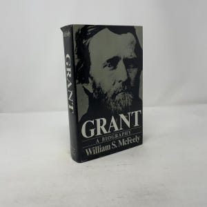 May include: A hardcover biography titled "GRANT" by William S. McFeely. The book features a black and white portrait of Ulysses S. Grant on the cover. The title and author's name are in white text against a black background.