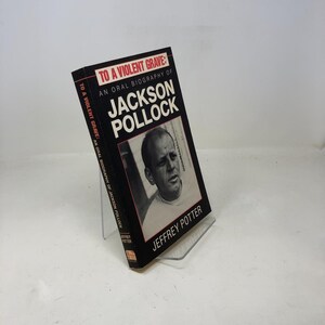 May include: A black and white book titled "To A Violent Grave: An Oral Biography of Jackson Pollock" by Jeffrey Potter. The cover features a black and white photo of Jackson Pollock.