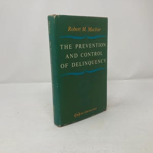 May include: A green hardback book titled "The Prevention and Control of Delinquency" by Robert M. MacIver.