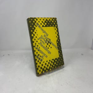 May include: A hardcover book titled "Managing the Small Dynamic Firm: Readings" by Lawrence A. Klatt. The cover features a yellow rectangle with black text and a dotted pattern in shades of green and brown.