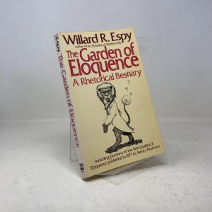 May include: A hardcover book titled "The Garden of Eloquence" by Willard R. Espy. The book has a cream-colored cover with red and black text and a whimsical illustration of a monkey-like figure. The book is a rhetorical bestiary.