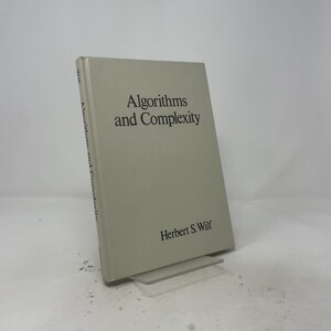 May include: A hardcover book titled Algorithms and Complexity by Herbert S. Wilf. The book has a light gray cover with black text. The title is printed in the center, and the author's name is printed near the bottom right corner of the cover.