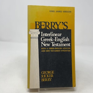 May include: A softcover book titled Berry's Interlinear Greek-English New Testament, King James Version, by George Ricker Berry. The cover features a yellow background, a black rectangular block, and a white illustration of a classical column.