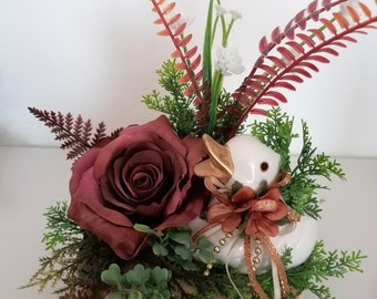 Artificial flower arrangement, rose, duck on tree disc