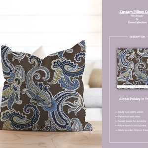 Pode incluir: Uma capa de almofada marrom com padrão paisley com detalhes em azul e amarelo. A capa de almofada é feita de 100% algodão e tem costuras overlocadas para maior durabilidade. O texto "Custom Pillow Cover Handmade by Eileen Collection" e "Global Paisley in Truffle" é visível na imagem.