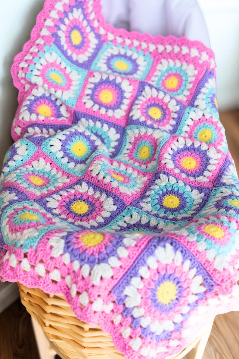 Colorful crochet baby blanket made from sunburst granny squares – Radiant Rays crochet pattern