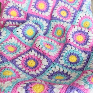Handmade crochet baby blanket with colorful squares – easy crochet pattern