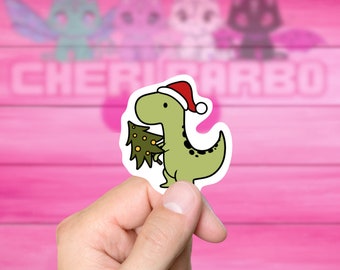 Jurassic Christmas Vinyl Sticker, perfect T-Rex holding his tree for year 'round holiday cheer, great for laptops, skateboards, phones