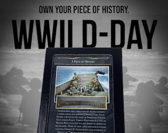 May include: A black leather-bound book with a photo of a World War II landing craft and soldiers on the cover. The book's title is "A Piece of History" and the text on the cover reads "WWII D-Day Landing Craft Higgins Boat Relic Recovered from Utah Beach".