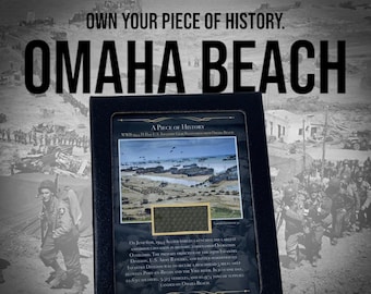 May include: A black framed plaque with a photo of a beach landing during World War II. The plaque reads "A Piece of History" and "WWII D-Day U.S. Infantry Gear Recovered from Omaha Beach". The text below the photo describes the events of D-Day, June 6, 1944.