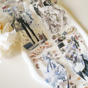 PET-tape met karakter engelenjongen|Gevallen in de mensenwereld|PET-tape met verbrijzeld schelpeffect|Lus van 100 cm|Journaling|Scrapbooking|Junkjournaal|