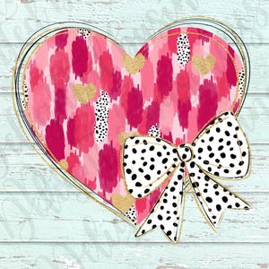 May include: A pink and gold heart with a black and white polka dot bow. The heart has a brushstroke pattern and gold glitter accents.