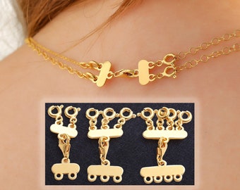 May include: Gold-tone necklace extender with three rows of loops and a lobster clasp. The extender is designed to add length to a necklace or to create a layered look.