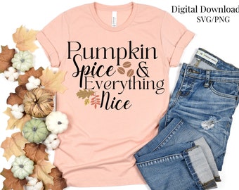 May include: A pink t-shirt with the text "Pumpkin Spice & Everything Nice" in black lettering. The shirt is decorated with a small brown leaf design and coffee beans.