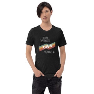 Graphic t-shirt of doing your own thing, be original, be yourself, life-affirming, gay-friendly, rainbow design, novelty tee, black tee