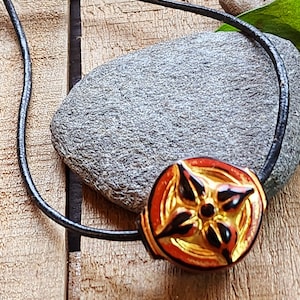 Bright red ornate charm necklace