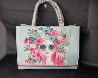 Bolsa de mano con diseño de niña con flores