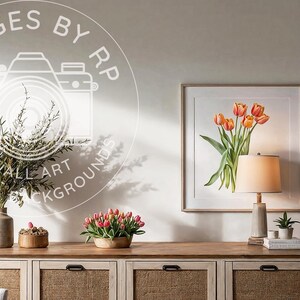 May include: A white dresser with six drawers, each with a woven rattan front. The dresser is topped with a lamp, a vase with greenery, a small potted plant, and a framed print of orange tulips.