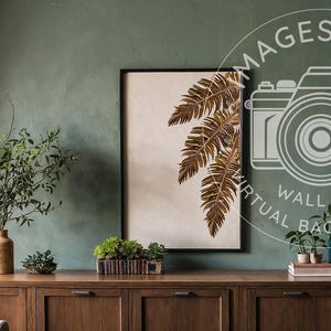 Puede incluir: Una impresión enmarcada de un helecho marrón sobre un fondo blanco cuelga de una pared verde salvia sobre un armario de madera con tres cajones. El armario está decorado con plantas en macetas y un jarrón con vegetación.