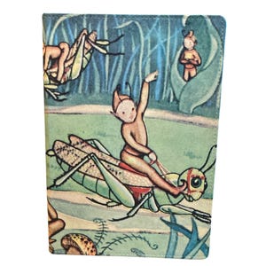 May include: A whimsical, vintage-style wallet featuring a fairy riding a grasshopper. The illustration is set in a whimsical forest scene with other fairies and insects. The color palette includes greens, blues, and browns.