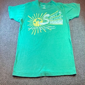 Sunny&#39;s Board Shop&quot; T-shirt, curated and clean