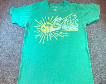 Sunny's Board Shop" T-shirt, curated and clean
