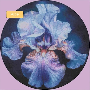 May include: A digital art print of a blue iris flower, with detailed pixelated textures. The flower is set against a dark background within a black circle, with a light purple background. A yellow box with the text "PDF" is in the upper left corner.