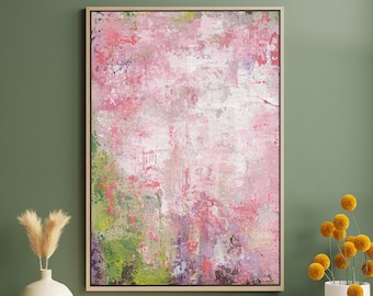 May include: Abstract painting with pink, green, and white colors. The painting has a textured look and is framed in a light wood frame.
