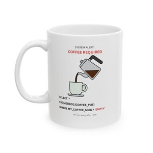 May include: White ceramic coffee mug with a handle. The mug features a graphic of coffee being poured into a cup, with the text "SYSTEM ALERT: COFFEE REQUIRED" and a humorous SQL query about an empty coffee mug.