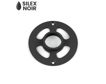 May include: Black metal ring with four cutouts and a center hole. The ring is about 2 inches in diameter.
