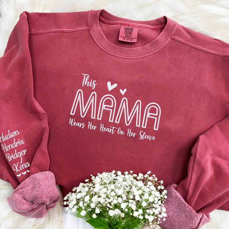 EMBROIDERED This Mama Wears Her Heart On Her Sleeve Sweatshirt, Comfort Colors® Mama Sweatshirt with Name, Mother's Day Gift for Mom image 1