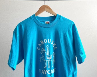 Vintage 90’s Single Stitch Carousel Daycare Blue Graphic T-Shirt - Large