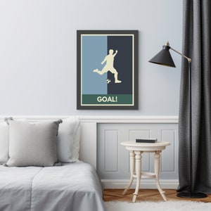 May include: A retro-style poster with a silhouette of a soccer player kicking a ball. The poster has a blue and black background with a green border and the word "GOAL!" in white text.